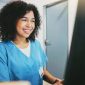 Nurse smiling at patient.